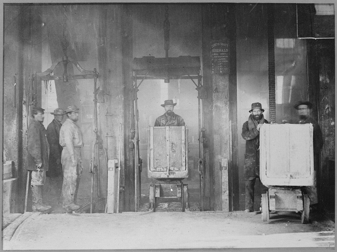Miners with ore cars at the Curtis Shaft of the Comstock Lode, Virginia City, Nevada