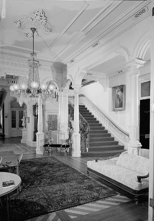 The entry hall and grand staircase inside Ralston Hall, Ralston's mansion in Belmont, California